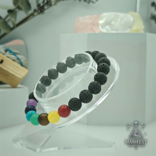 Multicolored beaded bracelet on a clear stand withManifest Supply Co. branding.