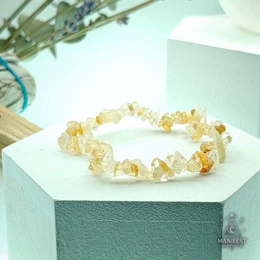 Citrine Chip Bracelet-Crystal bracelet on a white block with a blurred natural background