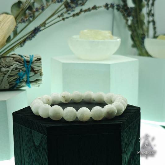 Rainbow Moonstone bracelet on a white stand with a blurred background