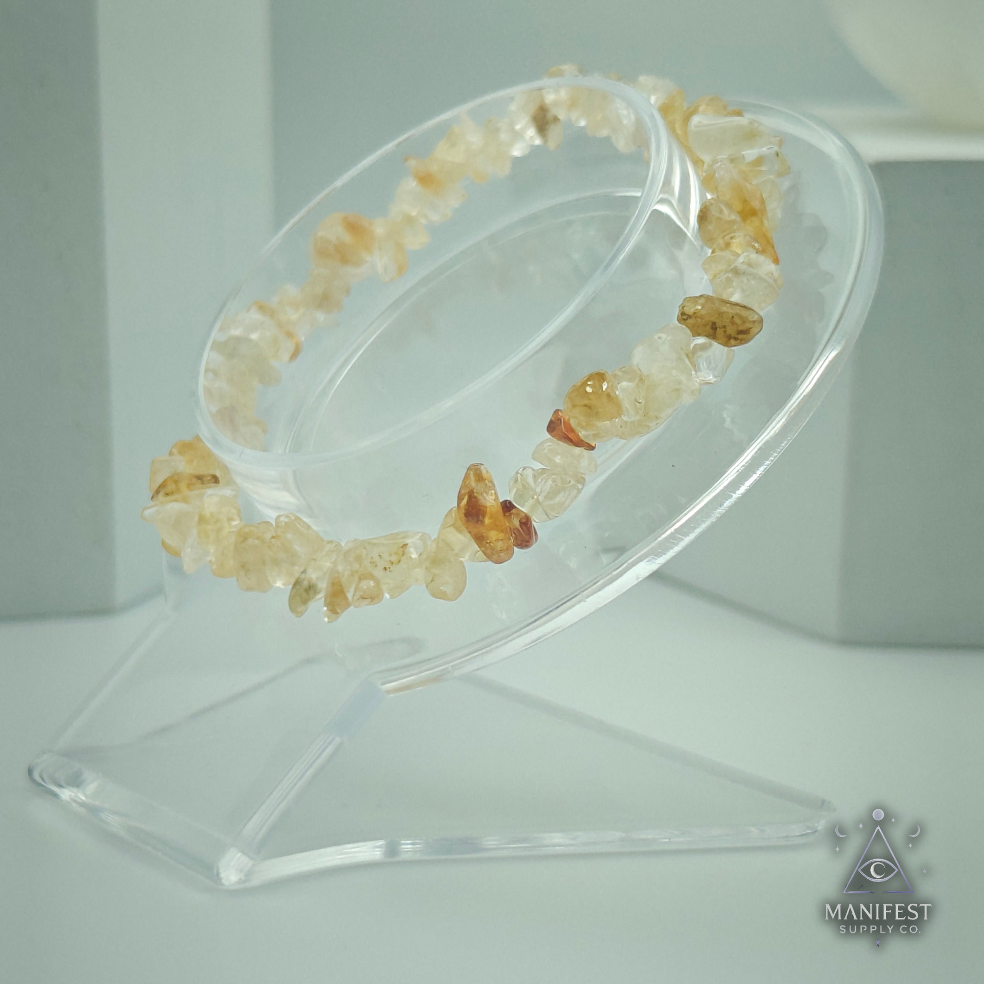 Citrine Chip Bracelet-Crystal bracelet on a clear stand with 'Manifest' branding.