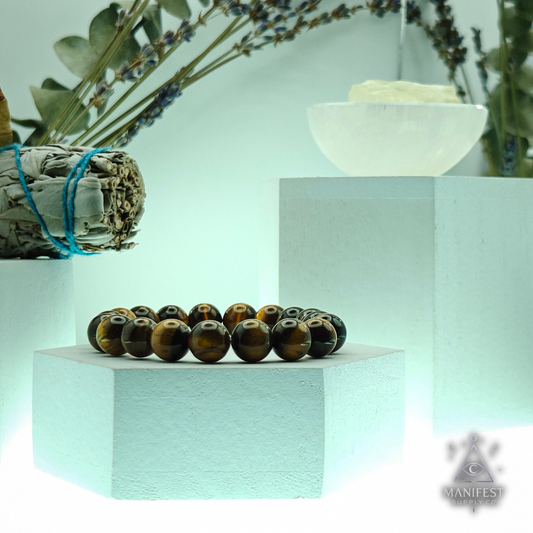 Beaded bracelet on a stand with plants and a crystal in the background